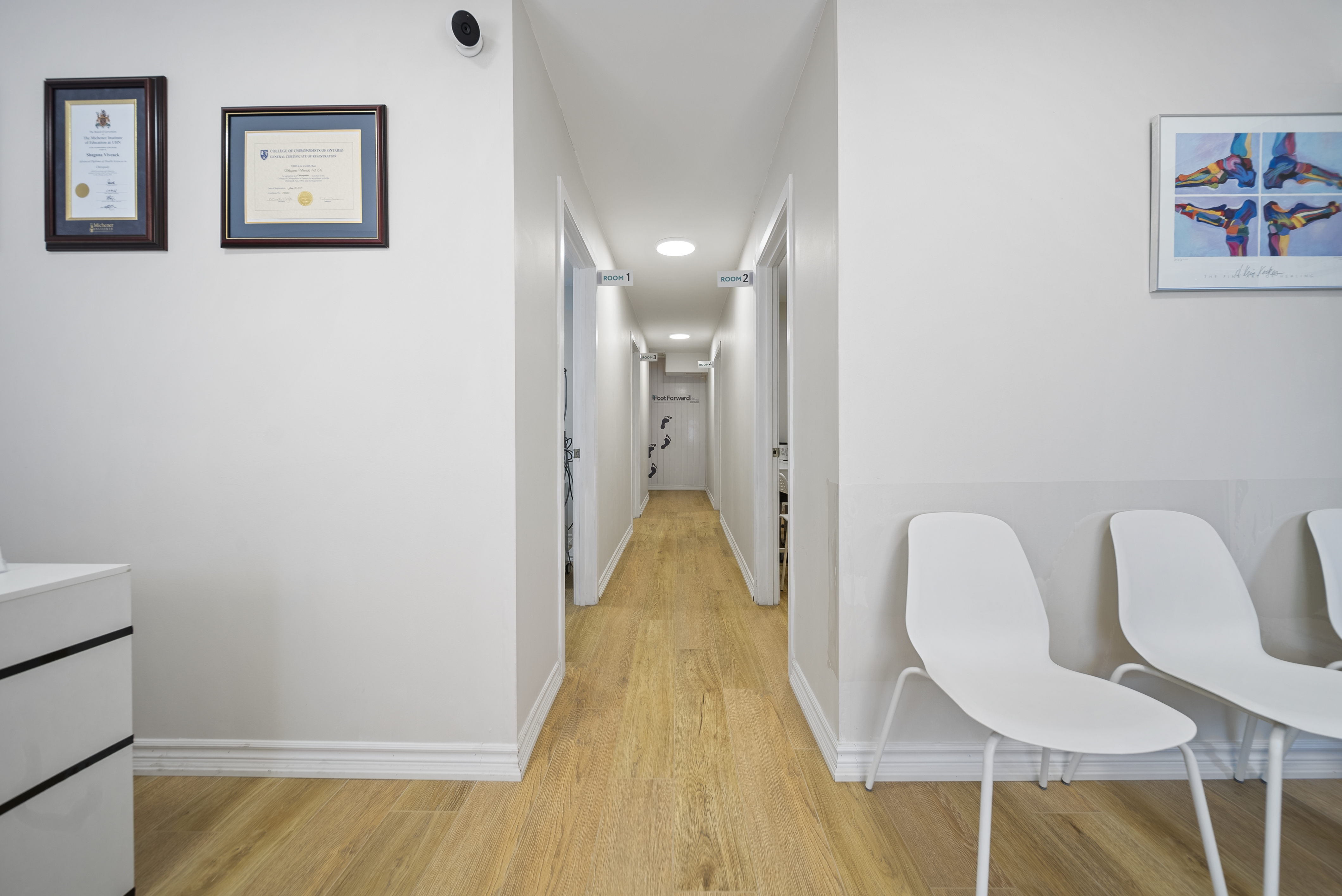 Foot Forward Clinic reception and waiting area with professional certifications