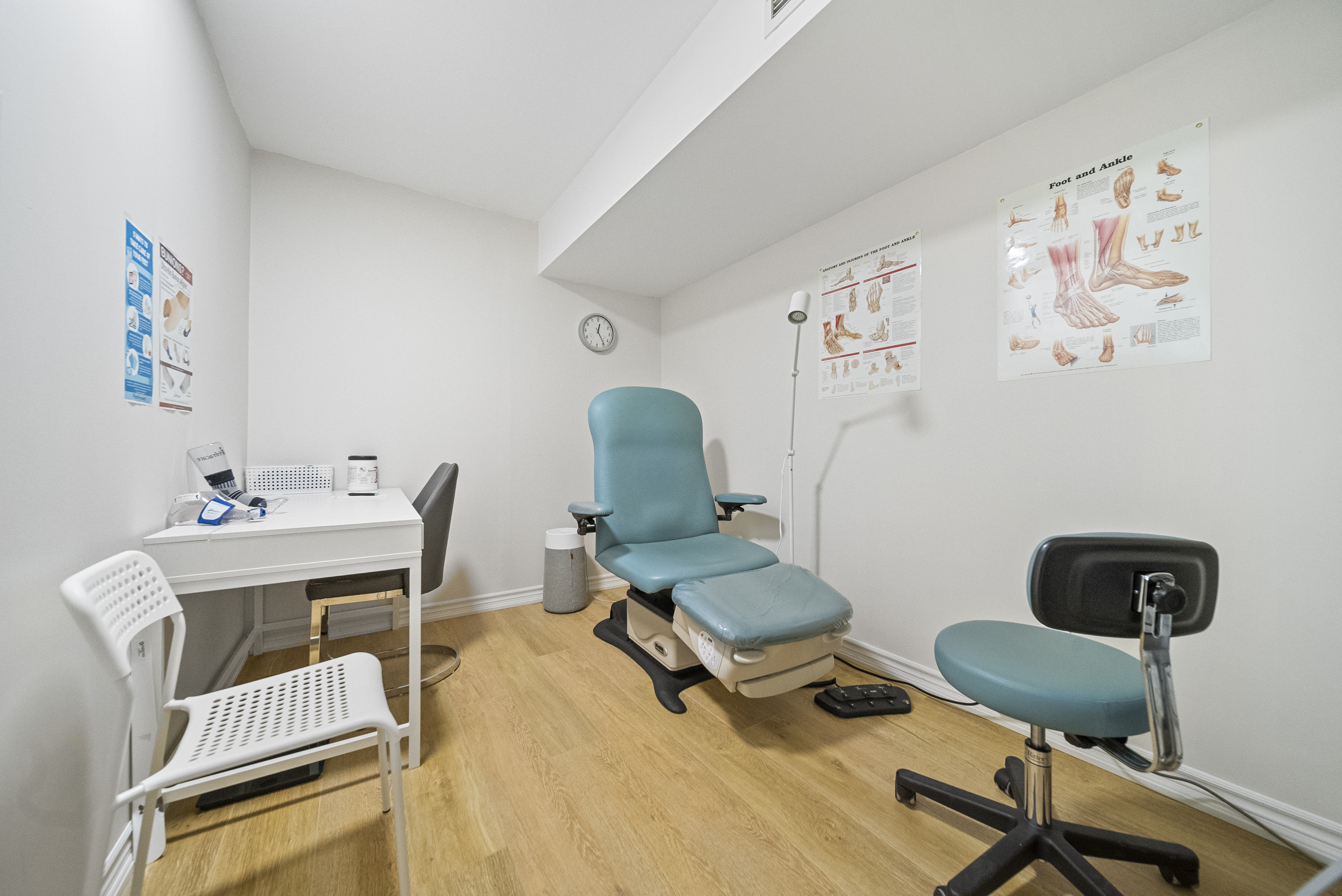 Modern treatment room with specialized chiropody equipment